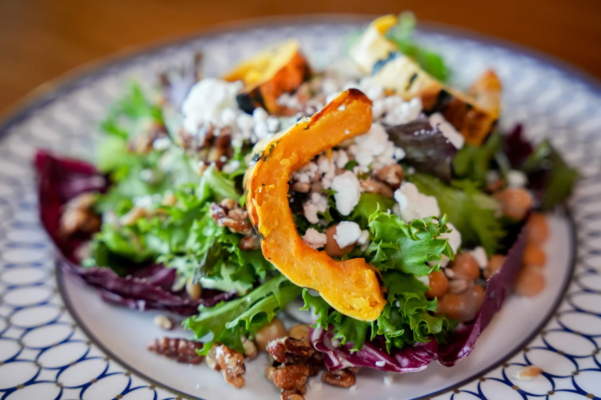 Mixed greens salad with roasted squash, blue cheese and candied pecans