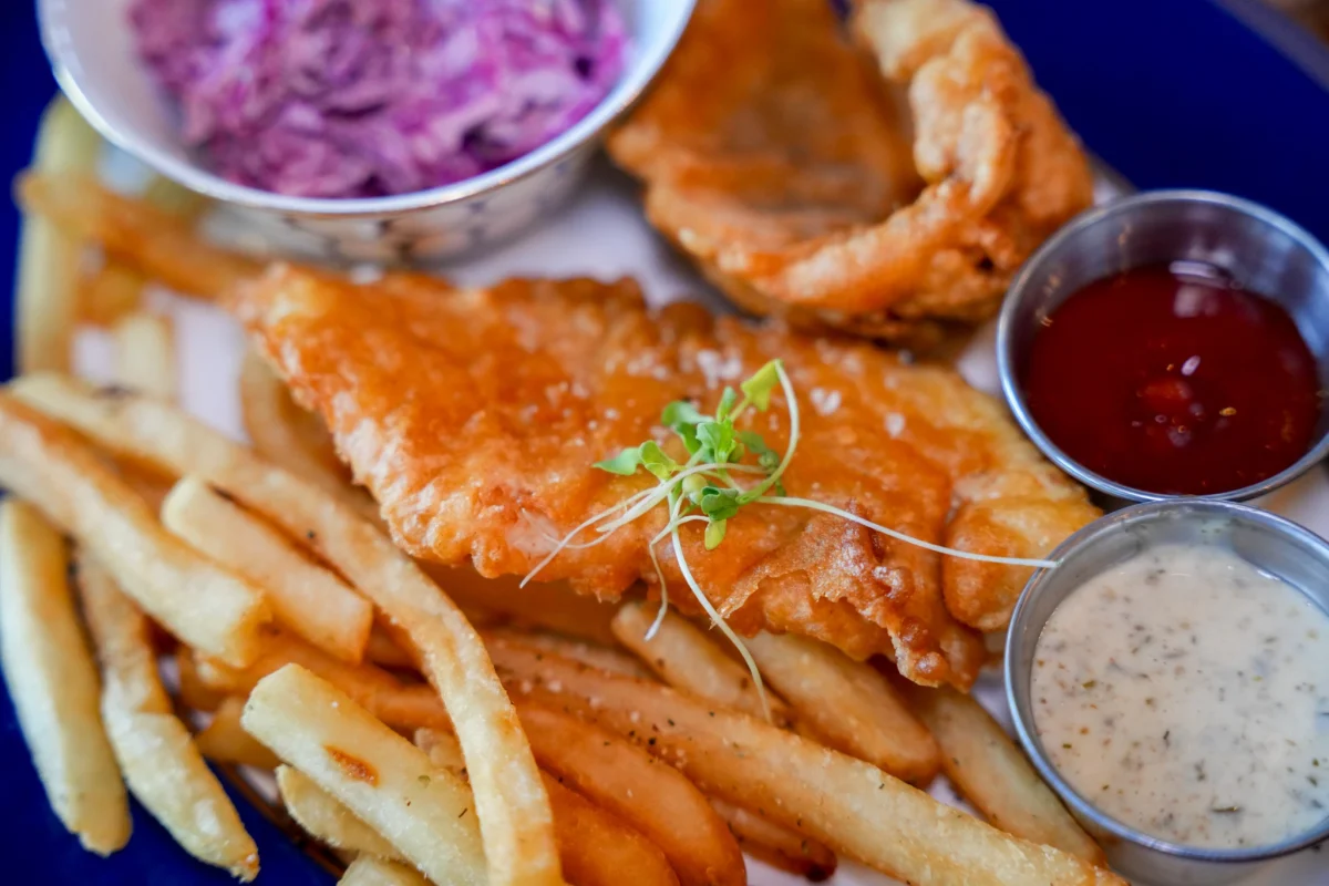 Beer-battered fish and chips with slaw, tartar sauce and ketchup