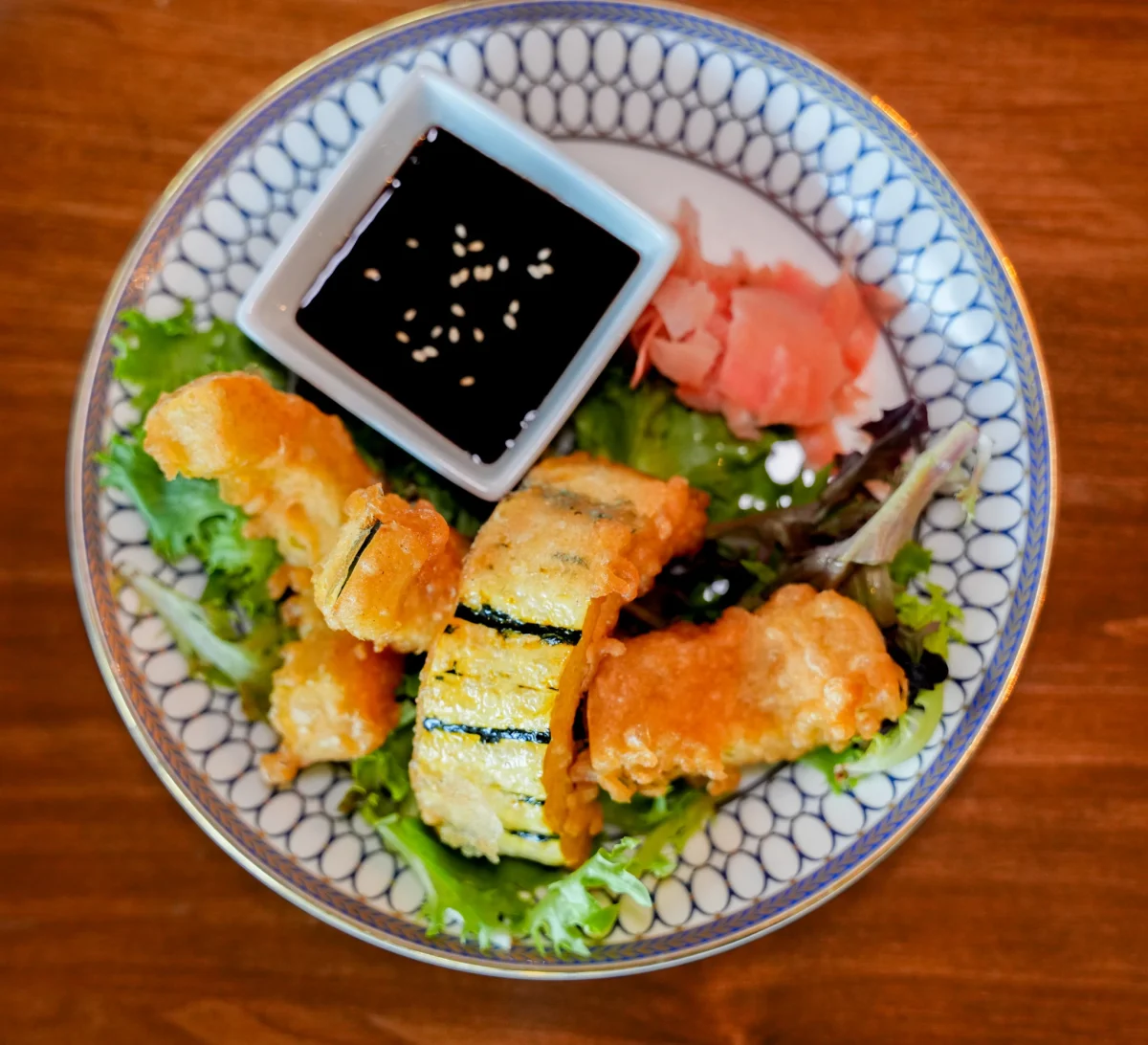 Tempura-fried appetizer with sesame soy dipping sauce and pickled ginger