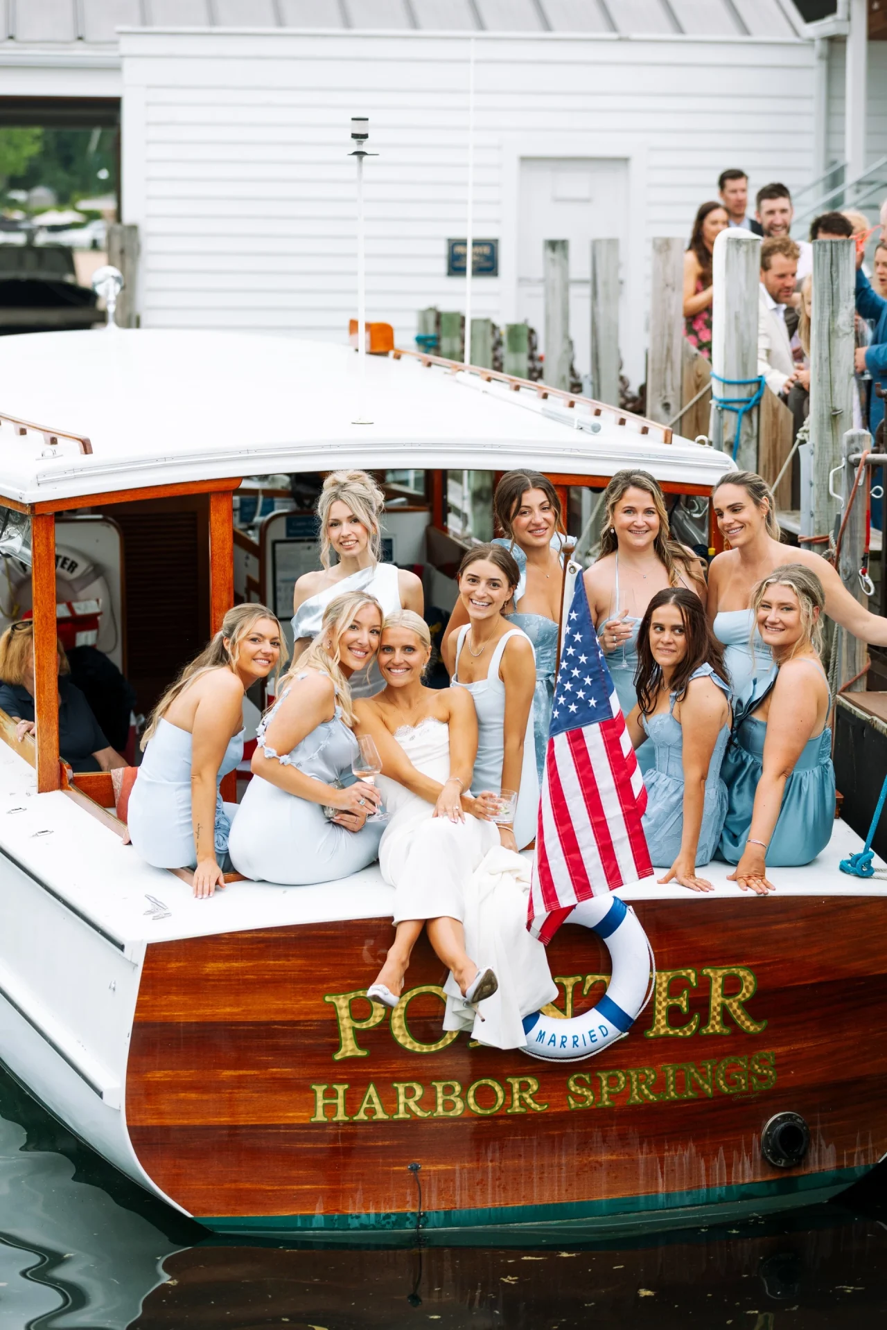Bridal party posing on the Pointer boat at the Harbor Springs dock