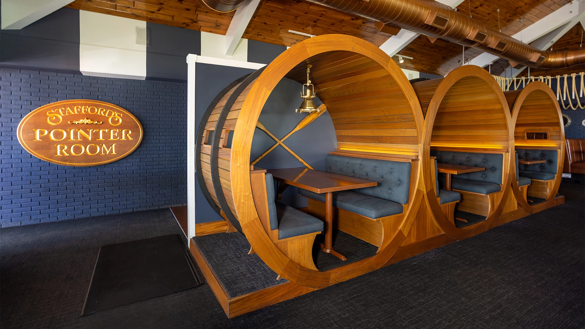 Barrel-shaped wooden booths in the Pointer Room