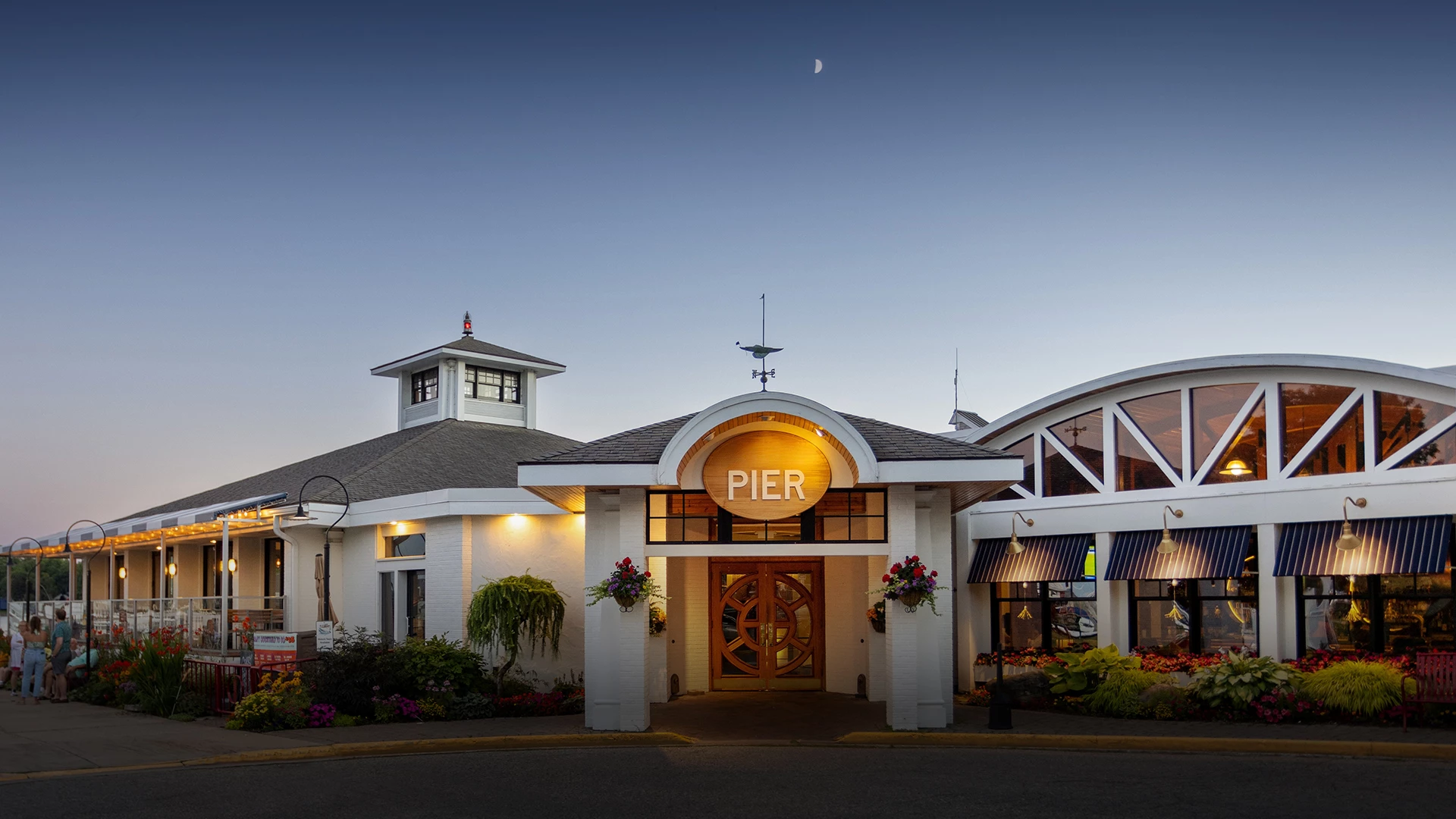 The Pier restaurant entrance lit at dusk