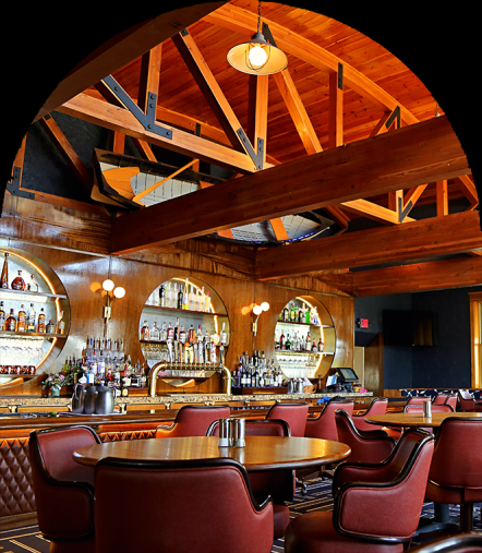 The Wheelhouse Lounge bar beneath its timbered vaulted ceiling